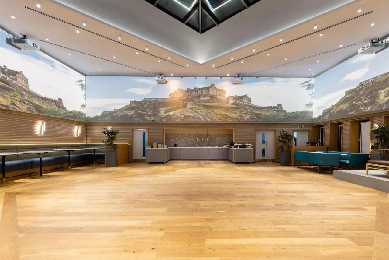 a large ballroom with a large mural on the wall at Yotel Edinburgh in Edinburgh